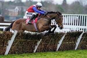 ESHER, ENGLAND - JANUARY 07: Jonathan Burke riding Love Envoi clear the last to win The Unibet 3 Uniboosts A Day Mares' Hurdle at Sandown Park on January 07, 2023 in Esher, England. (Photo by Alan Crowhurst/Getty Images)