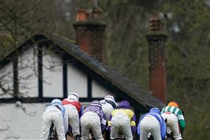 ESHER, ENGLAND - JANUARY 07: Runners make their way to the side of the track during The Unibet Tolworth Novices' Hurdle at Sandown Park on January 07, 2023 in Esher, England. (Photo by Alan Crowhurst/Getty Images)