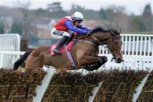 ESHER, ENGLAND - JANUARY 07: Jonathan Burke riding Love Envoi clear the last to win The Unibet 3 Uniboosts A Day Mares' Hurdle at Sandown Park on January 07, 2023 in Esher, England. (Photo by Alan Crowhurst/Getty Images)