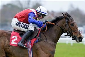 ESHER, ENGLAND - JANUARY 07: Jonathan Burke riding Love Envoi clear the last to win The Unibet 3 Uniboosts A Day Mares' Hurdle at Sandown Park on January 07, 2023 in Esher, England. (Photo by Alan Crowhurst/Getty Images)