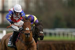 ESHER, ENGLAND - JANUARY 07: harry Cobden riding Tahmuras (white cap) clear the last to win The Unibet Tolworth Novices' Hurdle at Sandown Park on January 07, 2023 in Esher, England. (Photo by Alan Crowhurst/Getty Images)