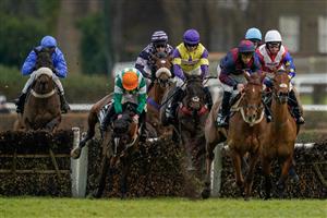 ESHER, ENGLAND - JANUARY 07: Jamie Moore riding Authorised Speed (L ,orange cap) make a mistake at the second flight of hurdles during The Unibet Tolworth Novices' Hurdle at Sandown Park on January 07, 2023 in Esher, England. (Photo by Alan Crowhurst/Getty Images)