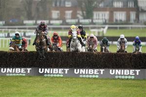 ESHER, ENGLAND - JANUARY 07: Alex Edwards riding Wishing And Hoping (L, grey/maroon) lead all the way to win The Unibet Veterans' Handicap Chase at Sandown Park on January 07, 2023 in Esher, England. (Photo by Alan Crowhurst/Getty Images)