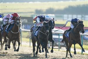 LINGFIELD, ENGLAND - JANUARY 21: Tom Marquand riding Obsidian Knight (blue/cream cap) win The Huge Daily Boosts Only At BetUK Handicap at Lingfield Park on January 21, 2023 in Lingfield, England. (Photo by Alan Crowhurst/Getty Images)
