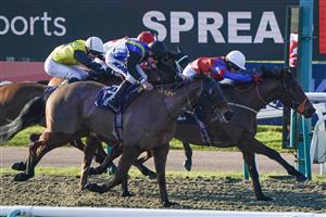 LINGFIELD, ENGLAND - JANUARY 21: Molly Gunn riding Beau Geste (R, white cap) win The Spreadex Sports First Goalscorer Insurance Classified Stakes at Lingfield Park on January 21, 2023 in Lingfield, England. (Photo by Alan Crowhurst/Getty Images)