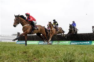 CHELTENHAM, ENGLAND - JANUARY 28: Niall Houlihan riding Editeur Du Gite (red) on their way to winning The Albert Bartlett Clarence House Chase at Cheltenham Racecourse on January 28, 2023 in Cheltenham, England. (Photo by Alan Crowhurst/Getty Images)