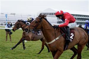 CHELTENHAM, ENGLAND - JANUARY 28: Niall Houlihan riding Editeur Du Gite (red) clear the last to win The Albert Bartlett Clarence House Chase at Cheltenham Racecourse on January 28, 2023 in Cheltenham, England. (Photo by Alan Crowhurst/Getty Images)