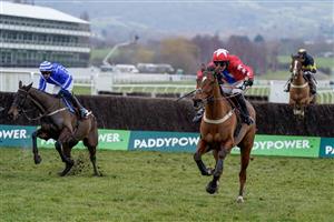 CHELTENHAM, ENGLAND - JANUARY 28: Niall Houlihan riding Editeur Du Gite (red) clear the last to win The Albert Bartlett Clarence House Chase at Cheltenham Racecourse on January 28, 2023 in Cheltenham, England. (Photo by Alan Crowhurst/Getty Images)