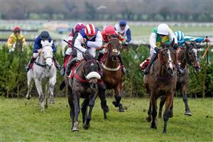 CHELTENHAM, ENGLAND - JANUARY 28: Sean Bowen riding Back On The Lash (red/white cap) clear the last to win The Glenfarclas Cross Country Handicap Chase at Cheltenham Racecourse on January 28, 2023 in Cheltenham, England. (Photo by Alan Crowhurst/Getty Images)