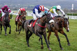 CHELTENHAM, ENGLAND - JANUARY 28: Sean Bowen riding Back On The Lash (red/white cap) clear the last to win The Glenfarclas Cross Country Handicap Chase at Cheltenham Racecourse on January 28, 2023 in Cheltenham, England. (Photo by Alan Crowhurst/Getty Images)
