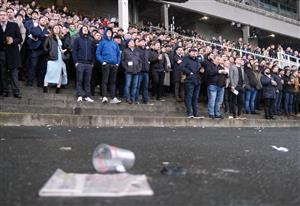 DUBLIN, IRELAND - FEBRUARY 04: Racegoers take cover in the grandstands as rain falls at Leopardstown Racecourse on February 04, 2023 in Dublin, Ireland. (Photo by Alan Crowhurst/Getty Images)