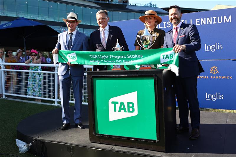 SYDNEY, AUSTRALIA - FEBRUARY 11: Trainers and owners celebrate as Nash Rawiller riding In Secret wins Race 7 TAB Light Fingers Stakes during the Inglis Millennium Day - Sydney Racing at Royal Randwick Racecourse on February 11, 2023 in Sydney, Australia. (Photo by Jeremy Ng/Getty Images)