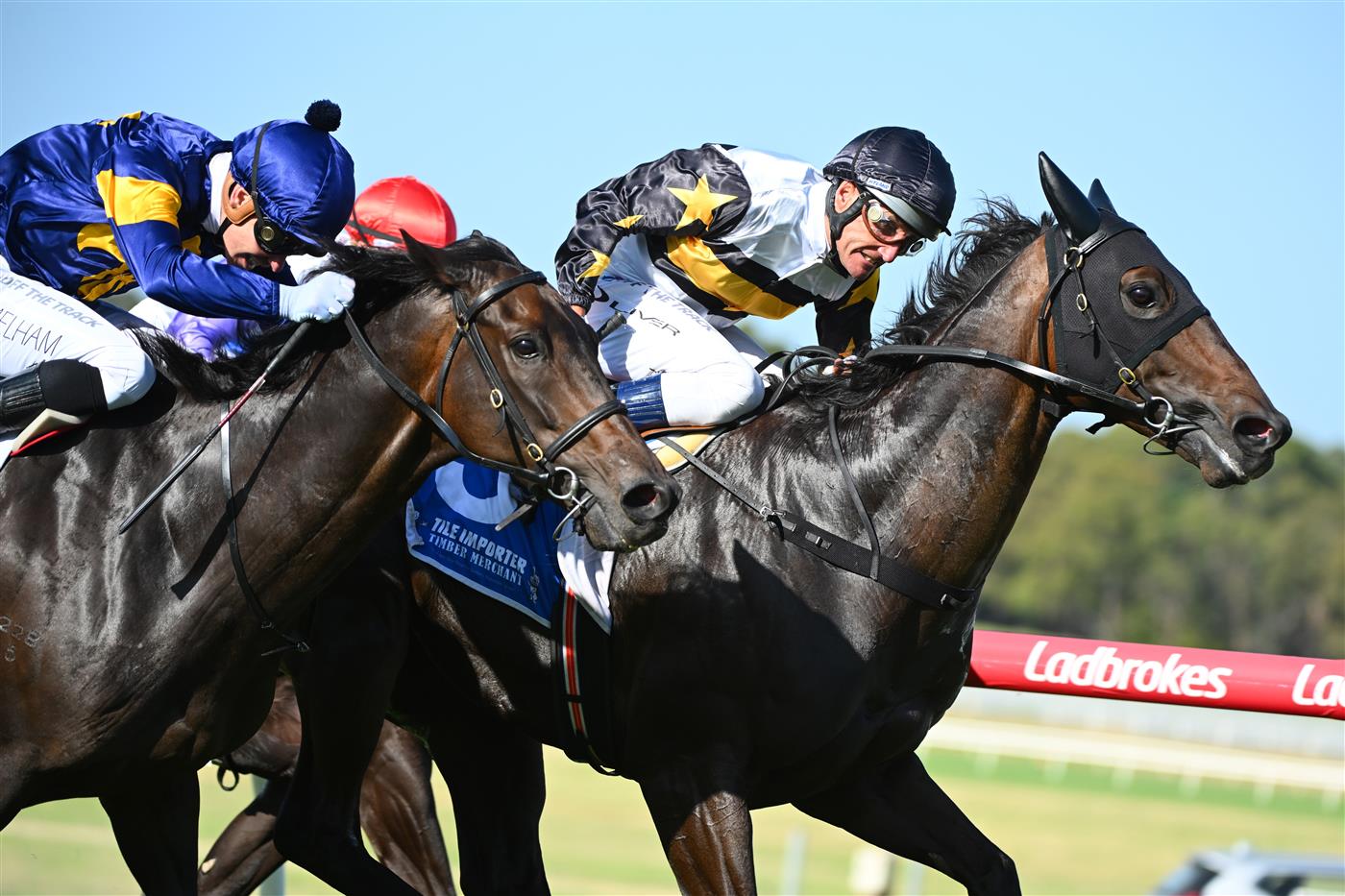 MELBOURNE, AUSTRALIA - FEBRUARY 11: Damien Oliver riding Here To Shock defeats Ben Melham riding Munhamek in Race 9, the Tile Importer Handicap, during Melbourne Racing at Sandown Hillside on February 11, 2023 in Melbourne, Australia. (Photo by Vince Caligiuri/Getty Images)