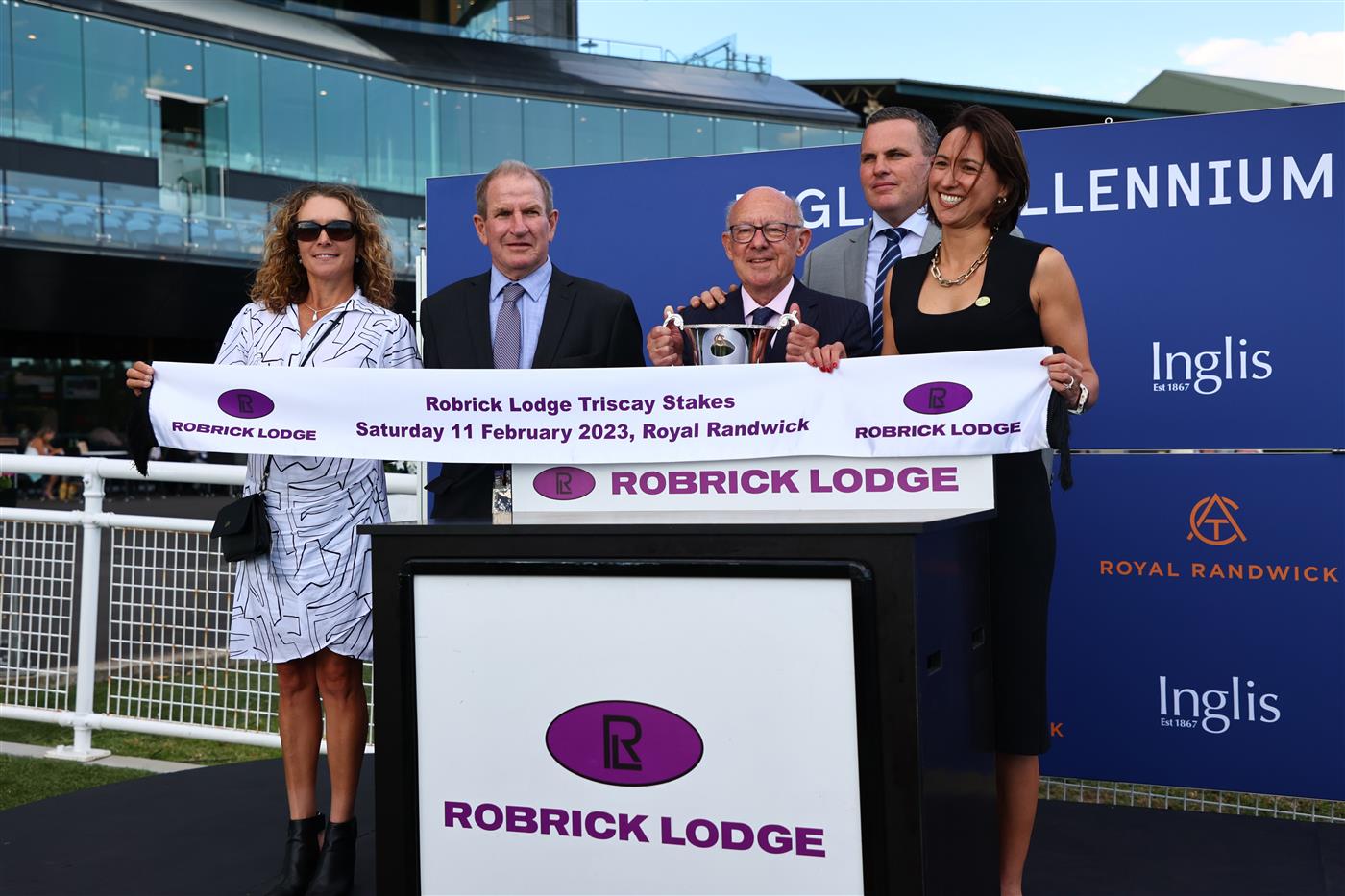 SYDNEY, AUSTRALIA - FEBRUARY 11: Trainer Bryce Heys celebrates Tyler Schiller riding Po Kare Kare wins Race 9 Robrick Lodge Triscay Stakes during the Inglis Millennium Day - Sydney Racing at Royal Randwick Racecourse on February 11, 2023 in Sydney, Australia. (Photo by Jeremy Ng/Getty Images)