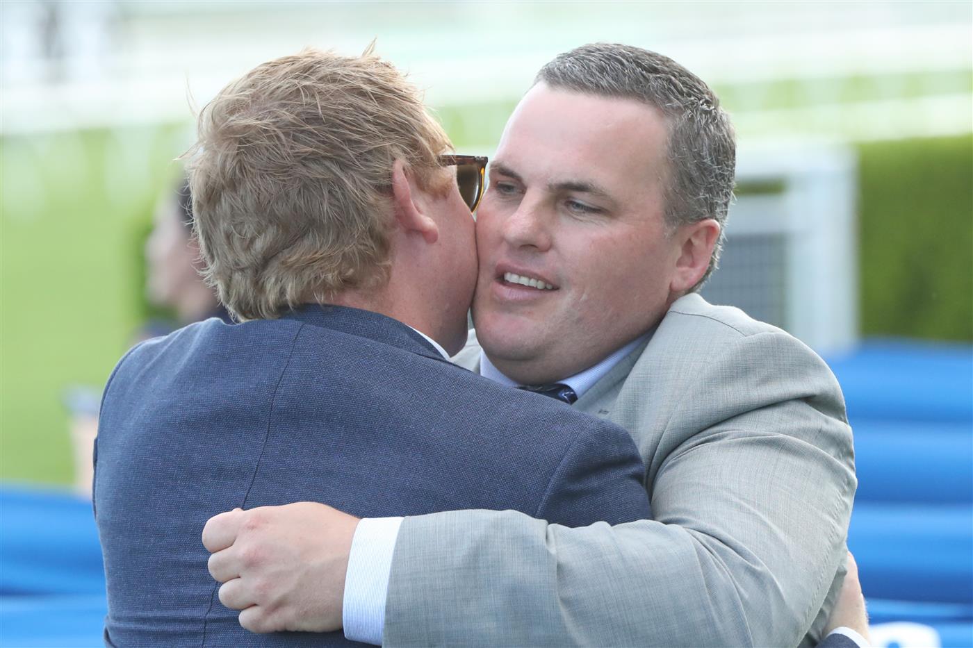 SYDNEY, AUSTRALIA - FEBRUARY 11: Trainer Bryce Heys celebrates Tyler Schiller riding Po Kare Kare wins Race 9 Robrick Lodge Triscay Stakes during the Inglis Millennium Day - Sydney Racing at Royal Randwick Racecourse on February 11, 2023 in Sydney, Australia. (Photo by Jeremy Ng/Getty Images)