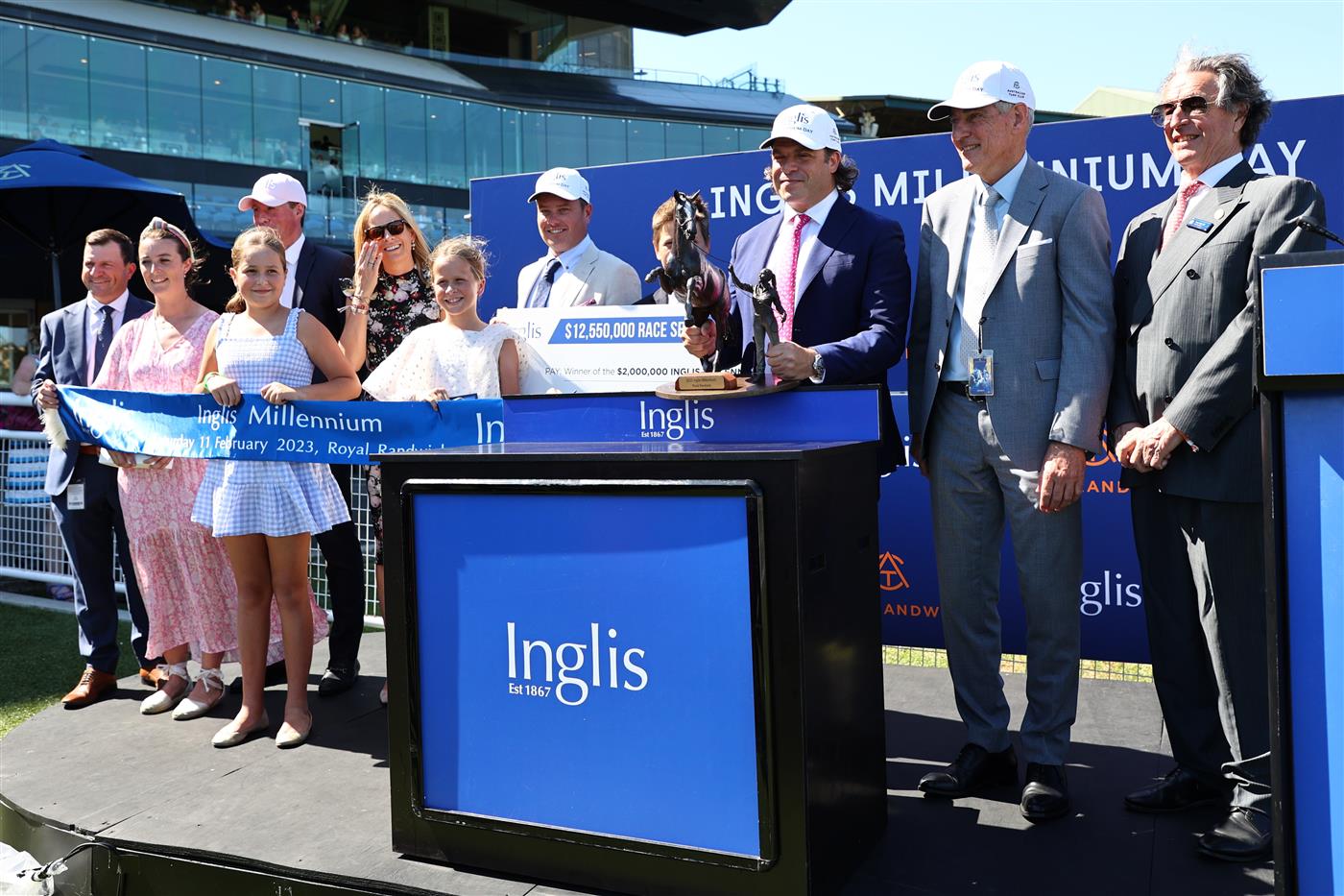 SYDNEY, AUSTRALIA - FEBRUARY 11: Trainers and owners celebrate as Chad Schofield riding Learning To Fly wins the Inglis Millennium during Sydney Racing at Royal Randwick Racecourse on February 11, 2023 in Sydney, Australia. (Photo by Jeremy Ng/Getty Images)