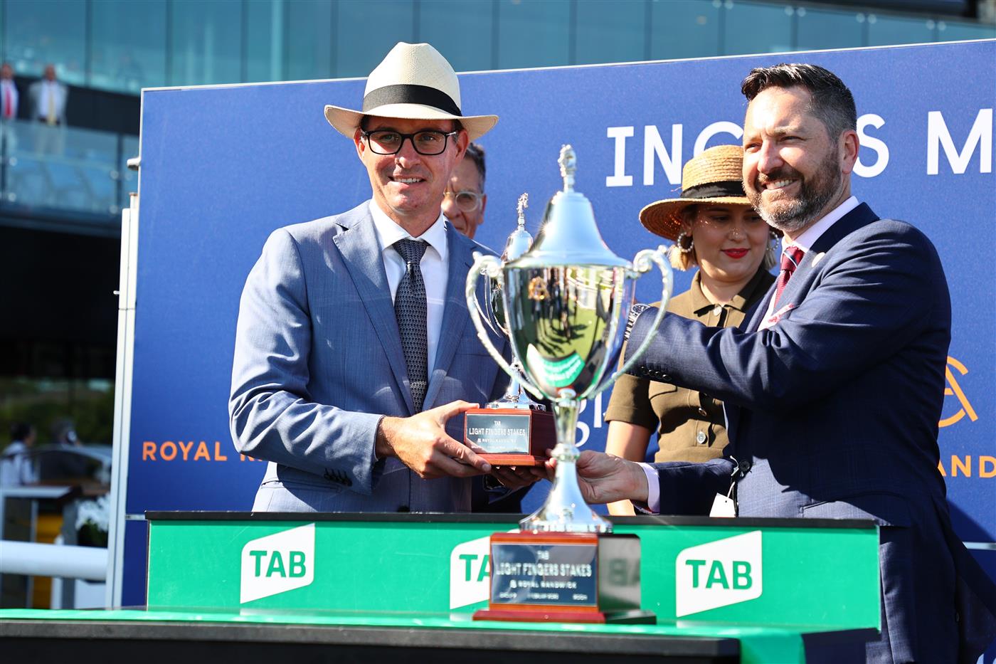 SYDNEY, AUSTRALIA - FEBRUARY 11: Trainers and owners celebrate as Nash Rawiller riding In Secret wins Race 7 TAB Light Fingers Stakes during the Inglis Millennium Day - Sydney Racing at Royal Randwick Racecourse on February 11, 2023 in Sydney, Australia. (Photo by Jeremy Ng/Getty Images)