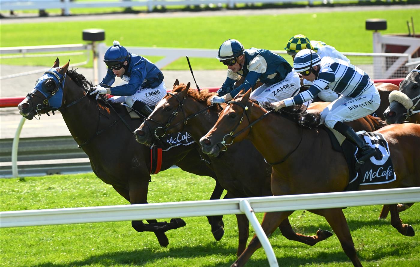 MELBOURNE, AUSTRALIA - FEBRUARY 11: Craig Newitt riding Lofty Strike defeats Damian Lane riding Uncommon James and Marine One (ctr) in Race 6, the Mccafe Rubiton Stakes, during Melbourne Racing at Sandown Hillside on February 11, 2023 in Melbourne, Australia. (Photo by Vince Caligiuri/Getty Images)