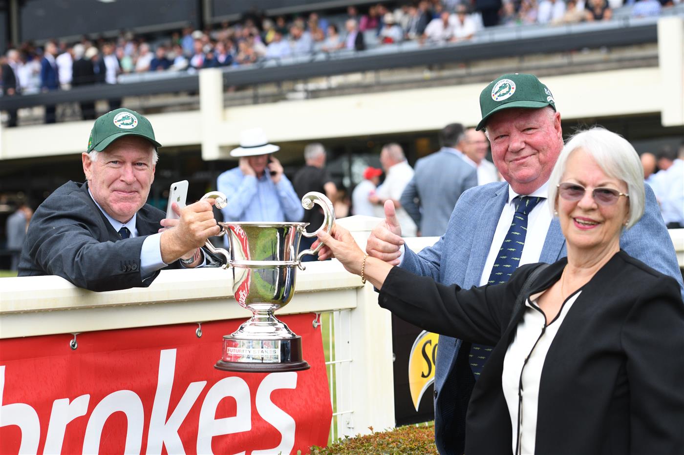 MELBOURNE, AUSTRALIA - FEBRUARY 25: Former part owner Allan Endresz gets to hold the winning trophy from the members lawn with Jeff and Robyn Simpson after Alligator Blood won Race 8, the Lamaro's Futurity Stakes, during Melbourne Racing at Sandown Lakeside on February 25, 2023 in Melbourne, Australia. (Getty)
