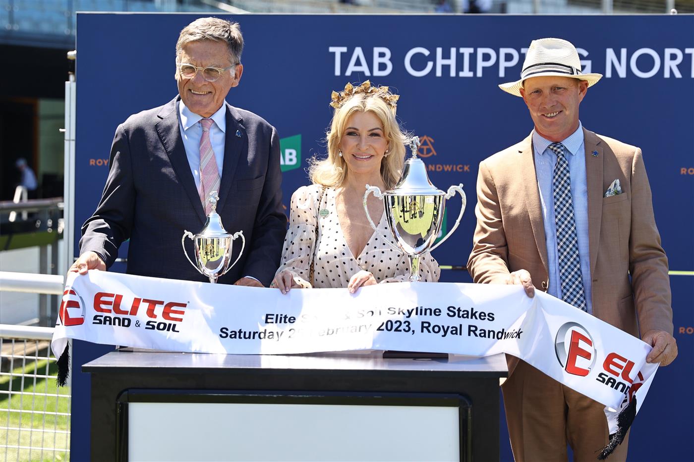SYDNEY, AUSTRALIA - FEBRUARY 25: Connections to horse Corniche is presented with winning trophies after Race 3 Elite Sand and Soil Skyline Stakes during TAB Chipping Norton Stakes Day - Sydney Racing at Royal Randwick Racecourse on February 25, 2023 in Sydney, Australia. (Photo by Jeremy Ng/Getty Images)