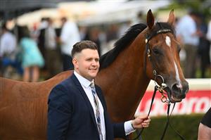 MELBOURNE, AUSTRALIA - FEBRUARY 25: Trainer Matthew Hoysted poses with Uncommon James after winning Race 9, the Ladbrokes Oakleigh Plate,  during Melbourne Racing at Sandown Lakeside on February 25, 2023 in Melbourne, Australia. (Photo by Vince Caligiuri/Getty Images)