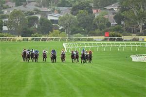 MELBOURNE, AUSTRALIA - FEBRUARY 25:  Ben Thompson riding Uncommon James (ctr) Race 9, the Ladbrokes Oakleigh Plate,  during Melbourne Racing at Sandown Lakeside on February 25, 2023 in Melbourne, Australia. (Photo by Vince Caligiuri/Getty Images)