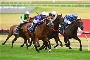 MELBOURNE, AUSTRALIA - FEBRUARY 25: Jye McNeil riding Espiona (L) winning Race 3, the Catanach's Jewellers Mannerism Stakes, during Melbourne Racing at Sandown Lakeside on February 25, 2023 in Melbourne, Australia. (Getty)