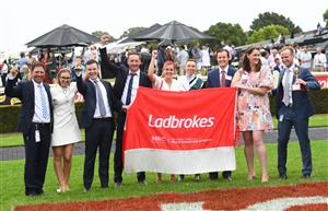 MELBOURNE, AUSTRALIA - FEBRUARY 25: Michael Dee poses with winning connections after riding Little Brose to win Race 7, the Ladbrokes Blue Diamond Stakes,  during Melbourne Racing at Sandown Lakeside on February 25, 2023 in Melbourne, Australia. (Photo by Vince Caligiuri/Getty Images)