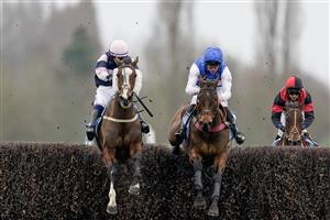 NEWBURY, ENGLAND - MARCH 04: Jonathan Burke riding The Big Bite (L) clear the last to win The BetVictor Greatwood Gold Cup Handicap Chase at Newbury Racecourse on March 04, 2023 in Newbury, England. (Photo by Alan Crowhurst/Getty Images)