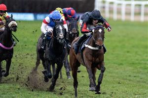 NEWBURY, ENGLAND - MARCH 04: Theo Gillard riding Fruit N Nut (black/red) clear the last to win The Make Your Best Bet At BetVictor Handicap Hurdle at Newbury Racecourse on March 04, 2023 in Newbury, England. (Photo by Alan Crowhurst/Getty Images)
