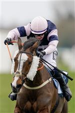 NEWBURY, ENGLAND - MARCH 04: Jonathan Burke riding The Big Bite (clear the last to win The BetVictor Greatwood Gold Cup Handicap Chase at Newbury Racecourse on March 04, 2023 in Newbury, England. (Photo by Alan Crowhurst/Getty Images)