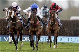 NEWBURY, ENGLAND - MARCH 04: Jonathan Burke riding The Big Bite (L) clear the last to win The BetVictor Greatwood Gold Cup Handicap Chase at Newbury Racecourse on March 04, 2023 in Newbury, England. (Photo by Alan Crowhurst/Getty Images)