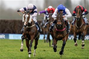 NEWBURY, ENGLAND - MARCH 04: Jonathan Burke riding The Big Bite (L) clear the last to win The BetVictor Greatwood Gold Cup Handicap Chase at Newbury Racecourse on March 04, 2023 in Newbury, England. (Photo by Alan Crowhurst/Getty Images)