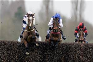 NEWBURY, ENGLAND - MARCH 04: Jonathan Burke riding The Big Bite (L) clear the last to win The BetVictor Greatwood Gold Cup Handicap Chase at Newbury Racecourse on March 04, 2023 in Newbury, England. (Photo by Alan Crowhurst/Getty Images)