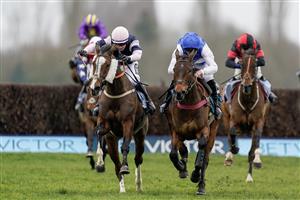 NEWBURY, ENGLAND - MARCH 04: Jonathan Burke riding The Big Bite (L) clear the last to win The BetVictor Greatwood Gold Cup Handicap Chase at Newbury Racecourse on March 04, 2023 in Newbury, England. (Photo by Alan Crowhurst/Getty Images)