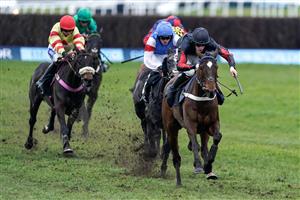 NEWBURY, ENGLAND - MARCH 04: Theo Gillard riding Fruit N Nut (black/red) clear the last to win The Make Your Best Bet At BetVictor Handicap Hurdle at Newbury Racecourse on March 04, 2023 in Newbury, England. (Photo by Alan Crowhurst/Getty Images)