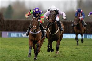 NEWBURY, ENGLAND - MARCH 04: Theo Gillard riding Cyclop (purple/green) clear the last to win The Bet In-Running On Racing At BetVictor Veterans' Handicap Chase at Newbury Racecourse on March 04, 2023 in Newbury, England. (Photo by Alan Crowhurst/Getty Images)