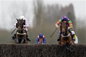 NEWBURY, ENGLAND - MARCH 04: Theo Gillard riding Cyclop (purple/green) clear the last to win The Bet In-Running On Racing At BetVictor Veterans' Handicap Chase at Newbury Racecourse on March 04, 2023 in Newbury, England. (Photo by Alan Crowhurst/Getty Images)