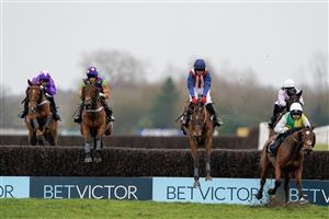 NEWBURY, ENGLAND - MARCH 04: Theo Gillard riding Cyclop (L, purple/green) clear the water jump before going on to win The Bet In-Running On Racing At BetVictor Veterans' Handicap Chase at Newbury Racecourse on March 04, 2023 in Newbury, England. (Photo by Alan Crowhurst/Getty Images)