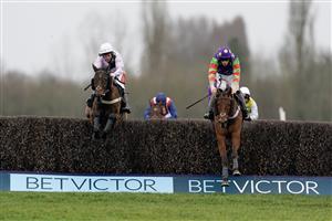 NEWBURY, ENGLAND - MARCH 04: Theo Gillard riding Cyclop (purple/green) clear the last to win The Bet In-Running On Racing At BetVictor Veterans' Handicap Chase at Newbury Racecourse on March 04, 2023 in Newbury, England. (Photo by Alan Crowhurst/Getty Images)
