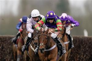 NEWBURY, ENGLAND - MARCH 04: Theo Gillard riding Cyclop (purple/green) clear the last to win The Bet In-Running On Racing At BetVictor Veterans' Handicap Chase at Newbury Racecourse on March 04, 2023 in Newbury, England. (Photo by Alan Crowhurst/Getty Images)