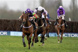 NEWBURY, ENGLAND - MARCH 04: Theo Gillard riding Cyclop (purple/green) clear the last to win The Bet In-Running On Racing At BetVictor Veterans' Handicap Chase at Newbury Racecourse on March 04, 2023 in Newbury, England. (Photo by Alan Crowhurst/Getty Images)