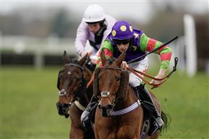 NEWBURY, ENGLAND - MARCH 04: Theo Gillard riding Cyclop (purple/green) clear the last to win The Bet In-Running On Racing At BetVictor Veterans' Handicap Chase at Newbury Racecourse on March 04, 2023 in Newbury, England. (Photo by Alan Crowhurst/Getty Images)