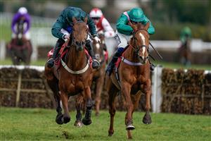 ESHER, ENGLAND - MARCH 11: Jamie Moore riding Spirit D'Aunou (L, dark green) clear the last to win The Racing Only Bettor Podcast Juvenile Handicap Hurdle at Sandown Park on March 11, 2023 in Esher, England. (Photo by Alan Crowhurst/Getty Images)