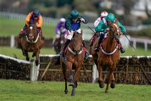 ESHER, ENGLAND - MARCH 11: Jamie Moore riding Spirit D'Aunou (L, dark green) clear the last to win The Racing Only Bettor Podcast Juvenile Handicap Hurdle at Sandown Park on March 11, 2023 in Esher, England. (Photo by Alan Crowhurst/Getty Images)