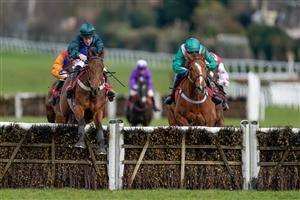 ESHER, ENGLAND - MARCH 11: Jamie Moore riding Spirit D'Aunou (L, dark green) clear the last to win The Racing Only Bettor Podcast Juvenile Handicap Hurdle at Sandown Park on March 11, 2023 in Esher, England. (Photo by Alan Crowhurst/Getty Images)
