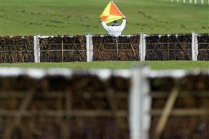 ESHER, ENGLAND - MARCH 11: The recall man raises his flag at the start at Sandown Park on March 11, 2023 in Esher, England. (Photo by Alan Crowhurst/Getty Images)