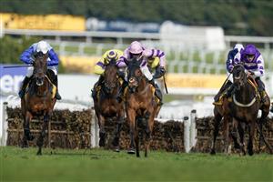 ESHER, ENGLAND - MARCH 11: Harry Cobden riding Iceo (pink) clear the last to win The Betfair Imperial Cup Handicap Hurdle at Sandown Park on March 11, 2023 in Esher, England. (Photo by Alan Crowhurst/Getty Images)