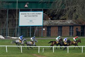 ESHER, ENGLAND - MARCH 11: Jamie Moore riding Hudson De Grugy (pink) on their way to winning The Betfair Daily Multiples Offer At Cheltenham Novices' Handicap Chase from Harry Cobden and Quel Destin at Sandown Park on March 11, 2023 in Esher, England. (Photo by Alan Crowhurst/Getty Images)