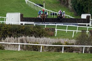 ESHER, ENGLAND - MARCH 11: Jamie Moore riding Hudson De Grugy (pink) on their way to winning The Betfair Daily Multiples Offer At Cheltenham Novices' Handicap Chase from Harry Cobden and Quel Destin at Sandown Park on March 11, 2023 in Esher, England. (Photo by Alan Crowhurst/Getty Images)